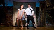 Kim Exum as Nabulungi and Cody Jamison Strand as Elder Cunningham in The Book of Mormon