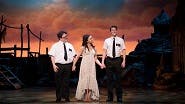 Cody Jamison Strand as Elder Cunningham, Kim Exum as Nabulungi and Dave Thomas Brown as Elder Price in The Book of Mormon