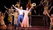 Hugh Jackman as Harold Hill and Sutton Foster as Marian Paroo and the cast of The Music Man