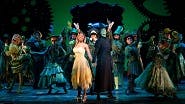 Brittney Johnson as Glinda, Talia Suskauer as Elphaba and the cast of Wicked